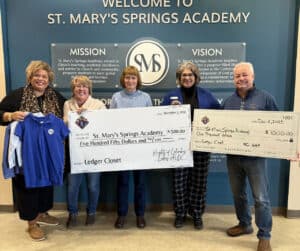 Ladies Auxiliary and Knights of Columbus big check to St. Mary's Springs Academy.